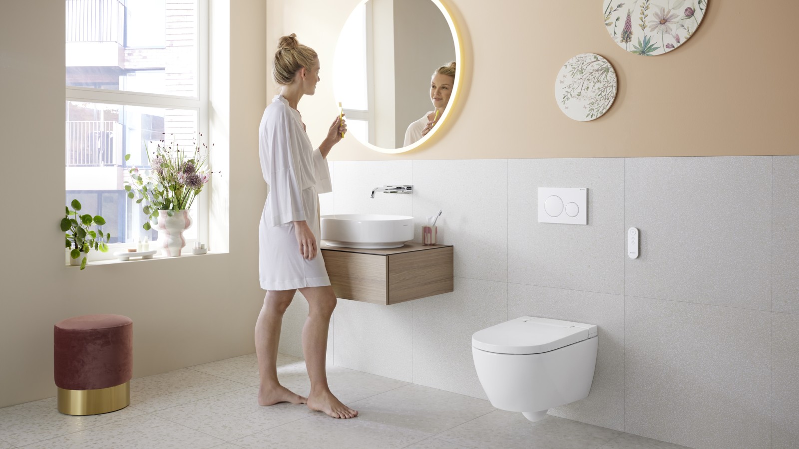 Bathroom in trendy Peach Fuzz with the Geberit AquaClean Alba shower toilet