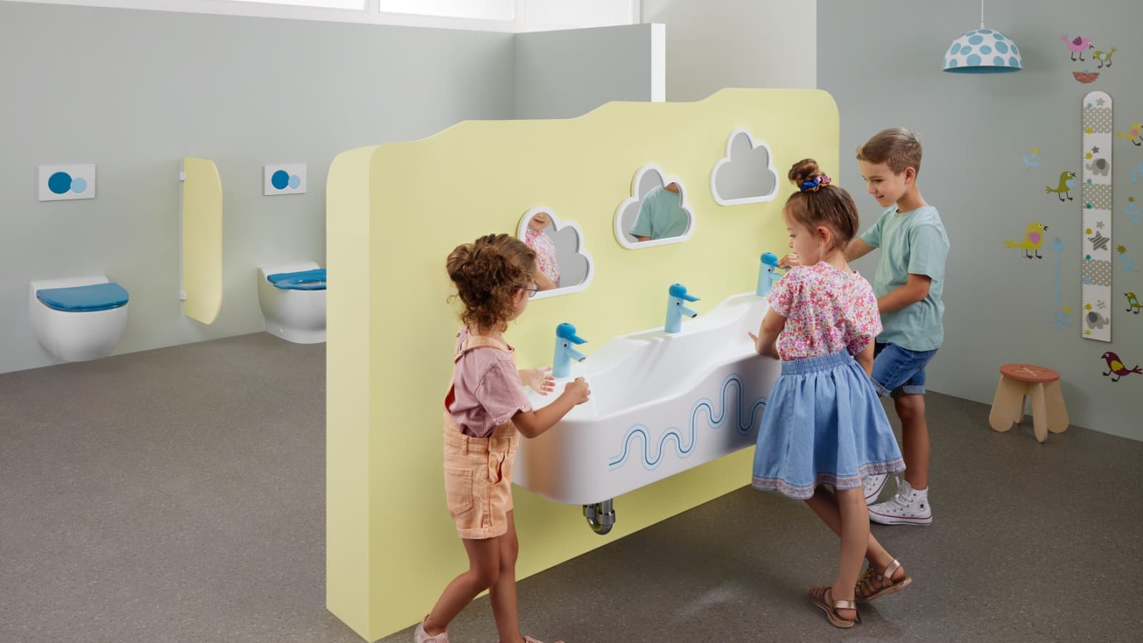 Children playing in a Geberit Bambini bathroom Children playing in a Geberit Bambini bathroom